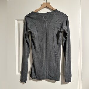 Lululemon tech long sleeve running top.  Size 8